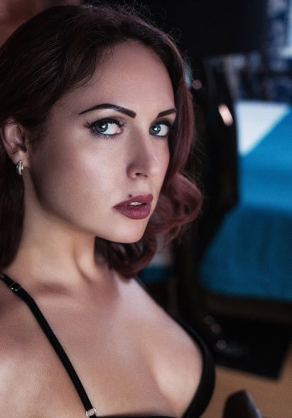 Auburn Haired Woman Looking at the Camera